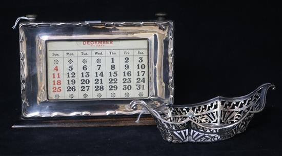 A 1920s silver mounted desk calendar and a late Victorian pierced silver dish.